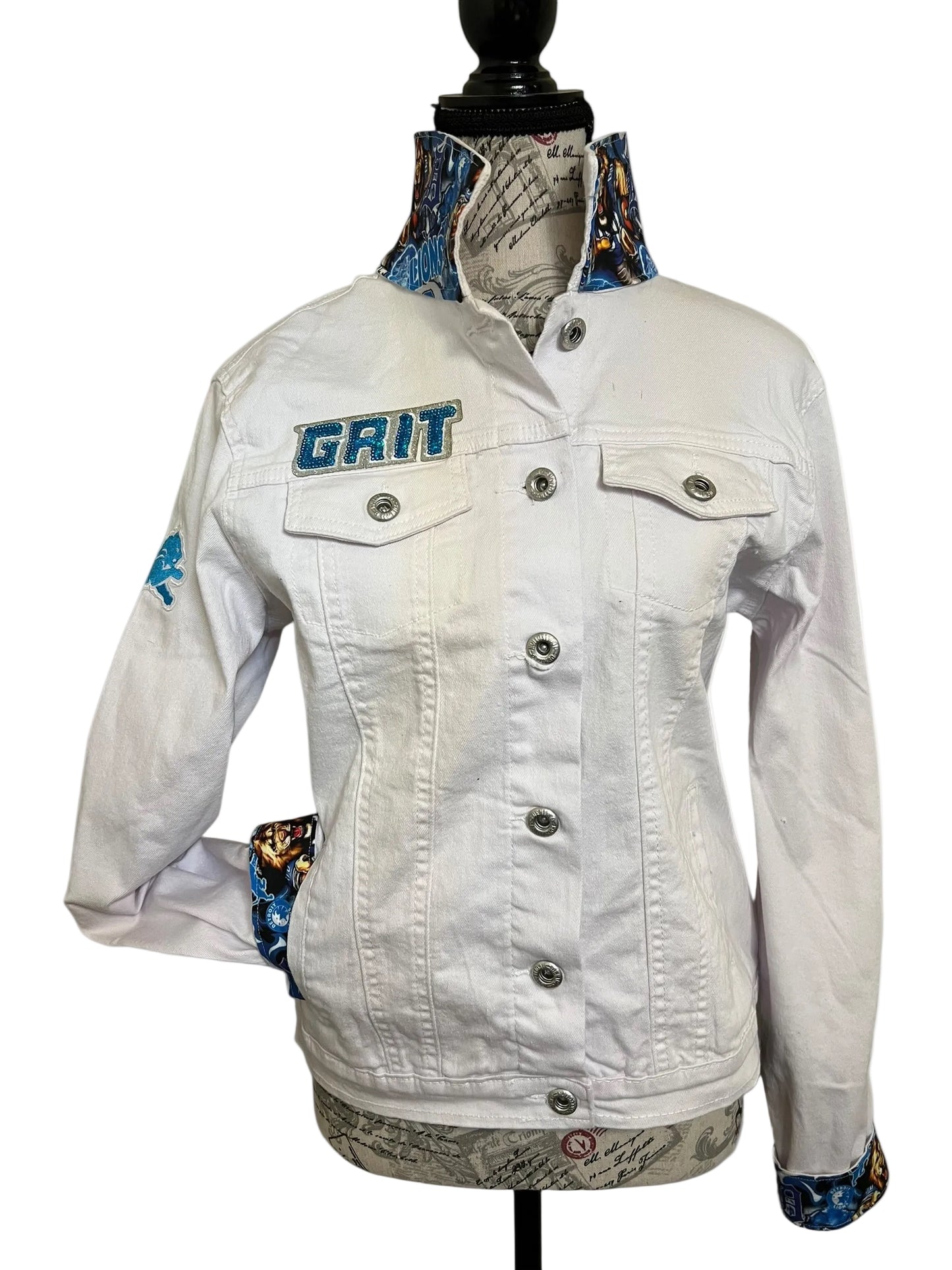White denim jacket with 'Grit' branding
