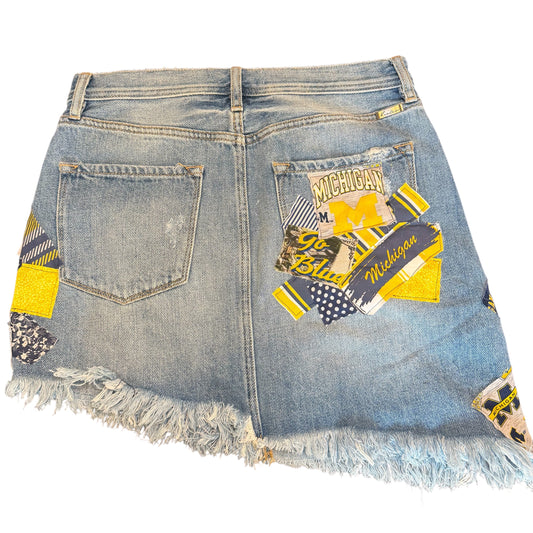Denim skirt with patches and frayed hem