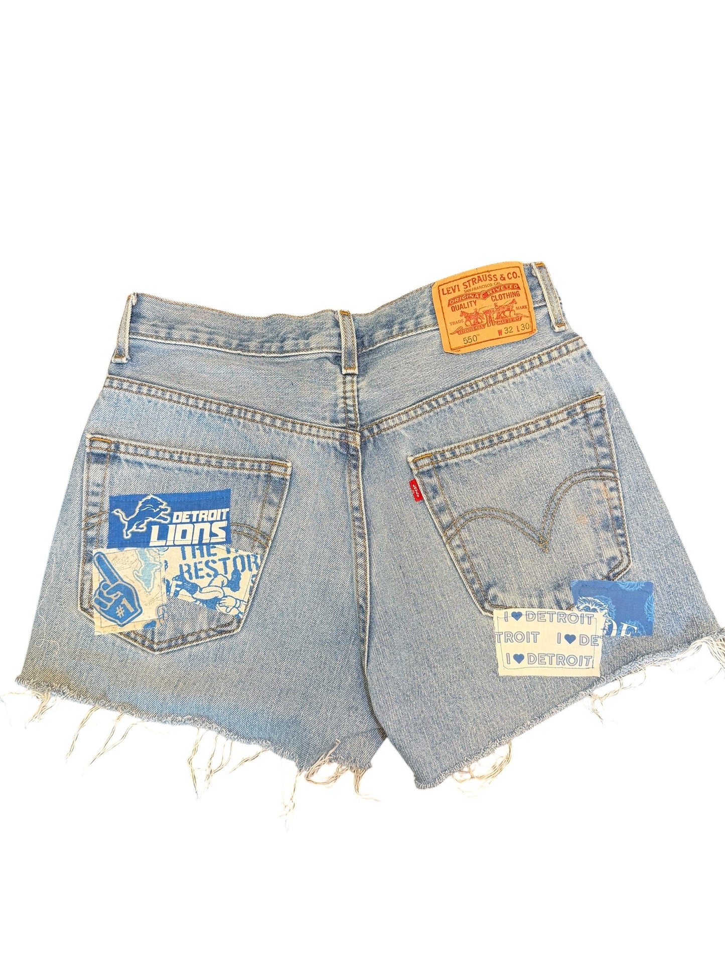 Levi 550 W 32 distressed blue denim cut off short shorts. I accented with with Detroit Lions.
