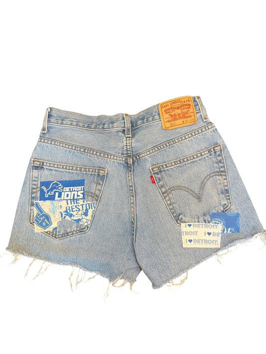Levi 550 W 32 distressed blue denim cut off short shorts. I accented with with Detroit Lions.