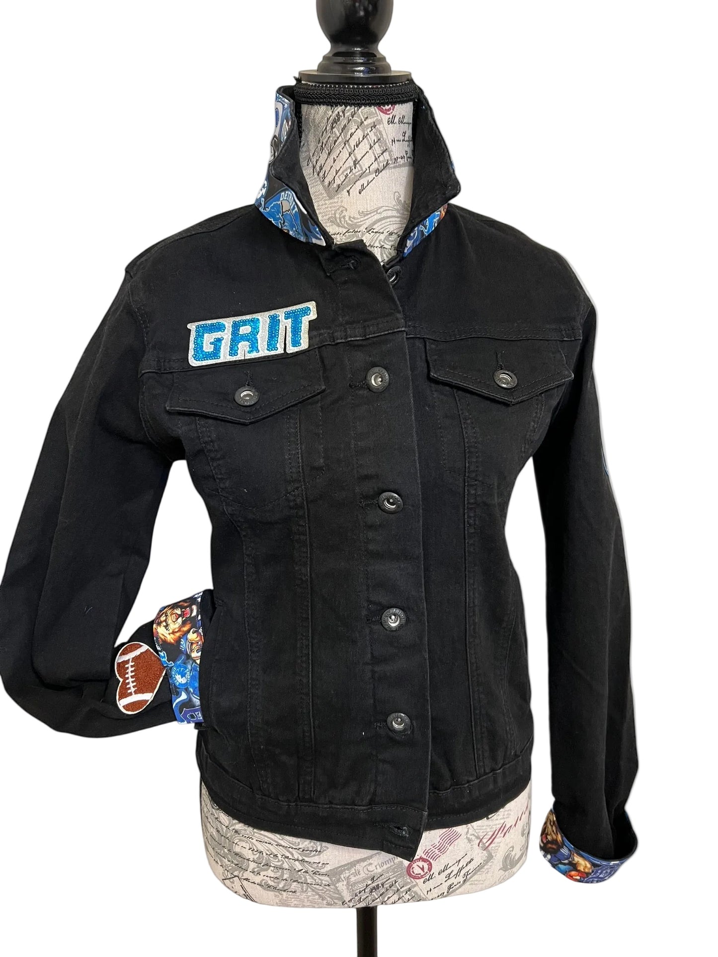Black jacket with 'GRIT' logo 