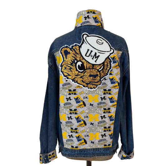 Denim jacket with Michigan Wolverines logo 