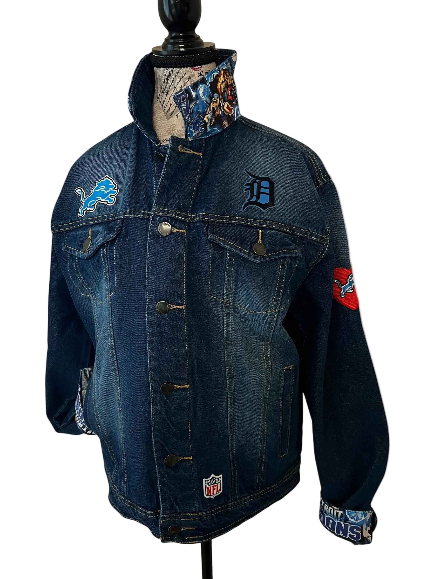 Blue denim jacket with embroidered logos 