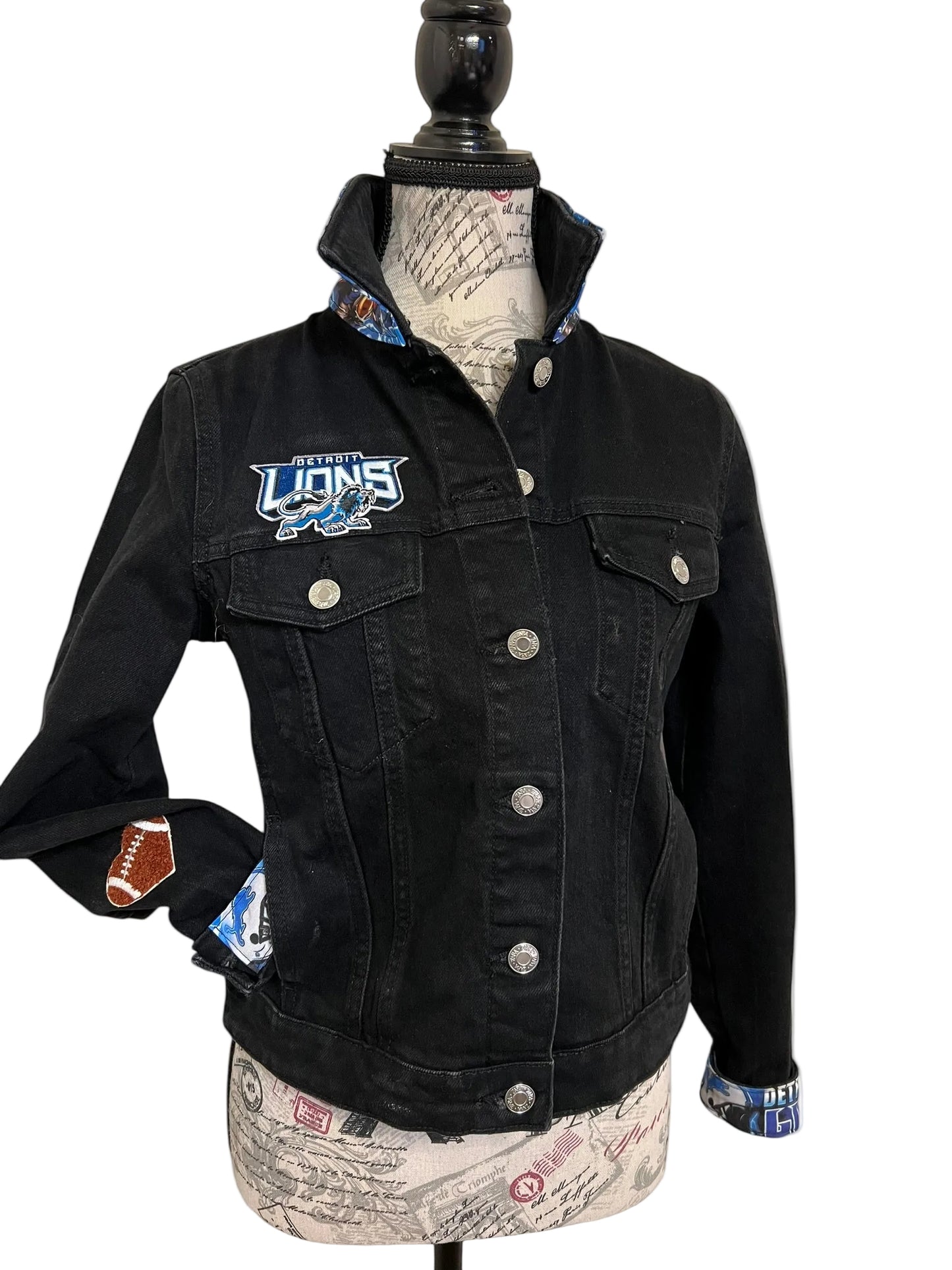Black denim jacket with a logo 