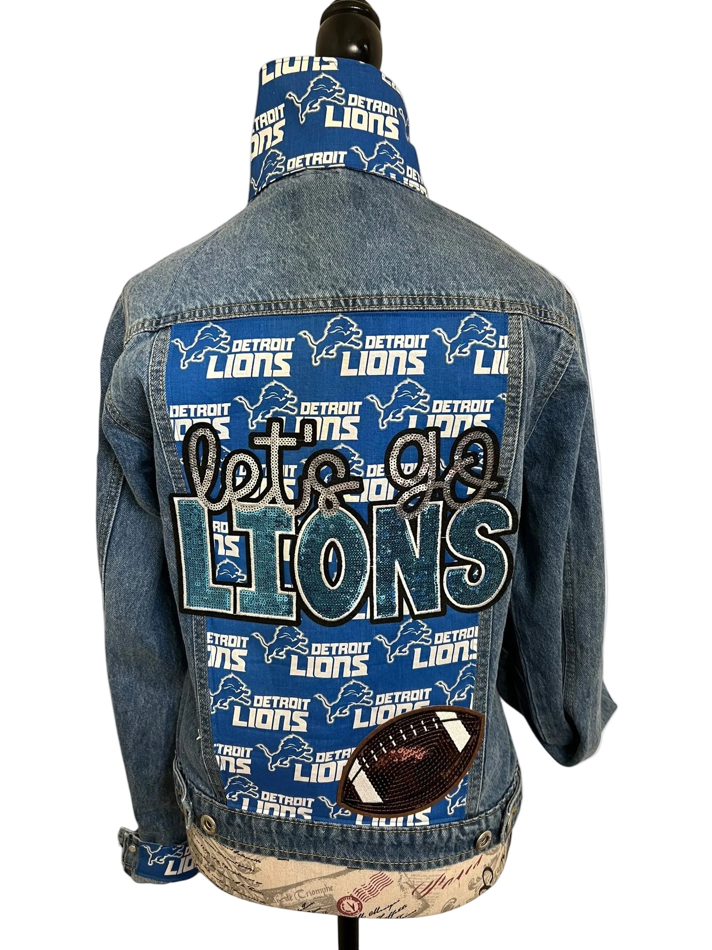 Denim jacket with Detroit Lions branding and graphics