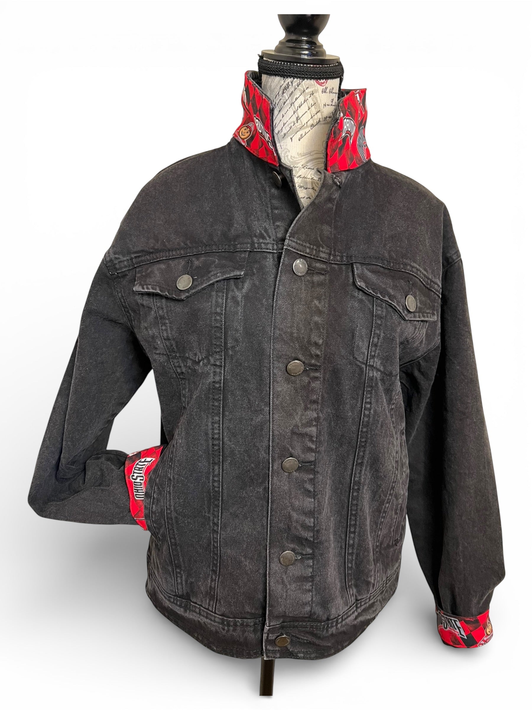 Black denim jacket with red accents 