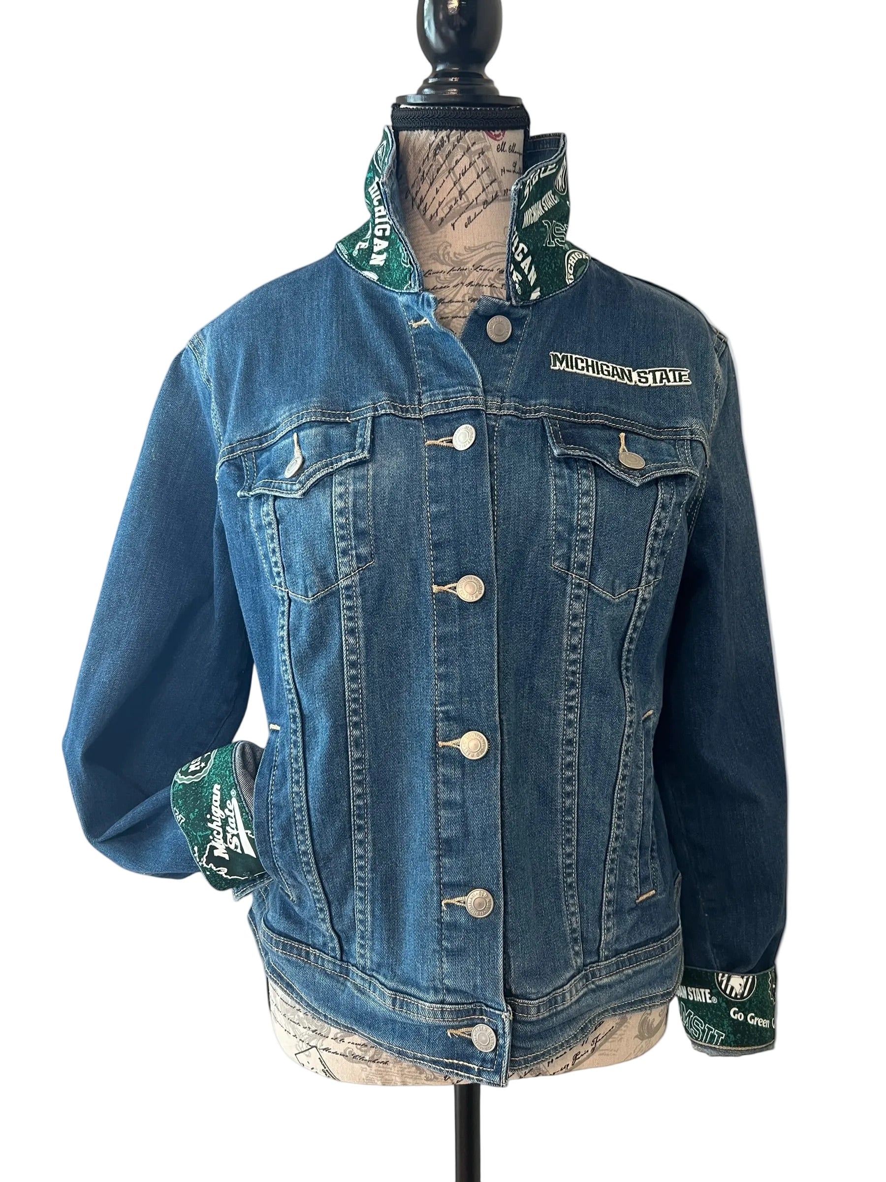 Blue denim jacket with Michigan State logo 