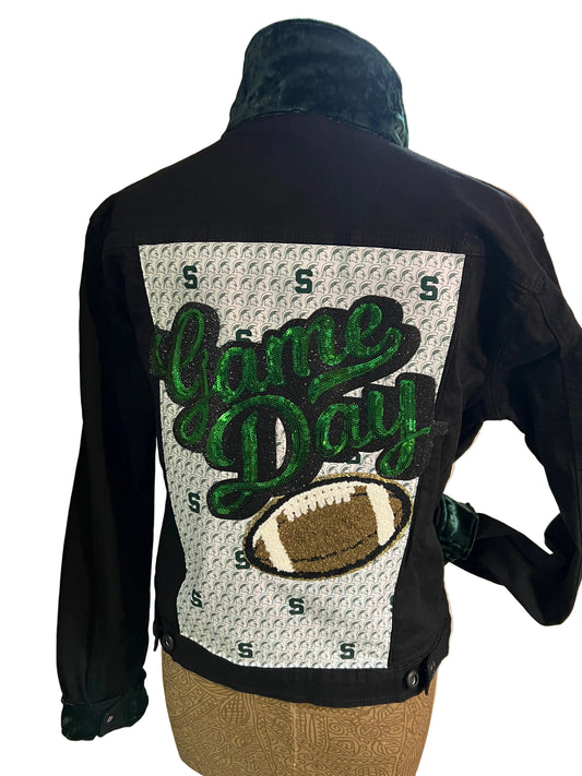 Black bag with green text and a football graphic 
