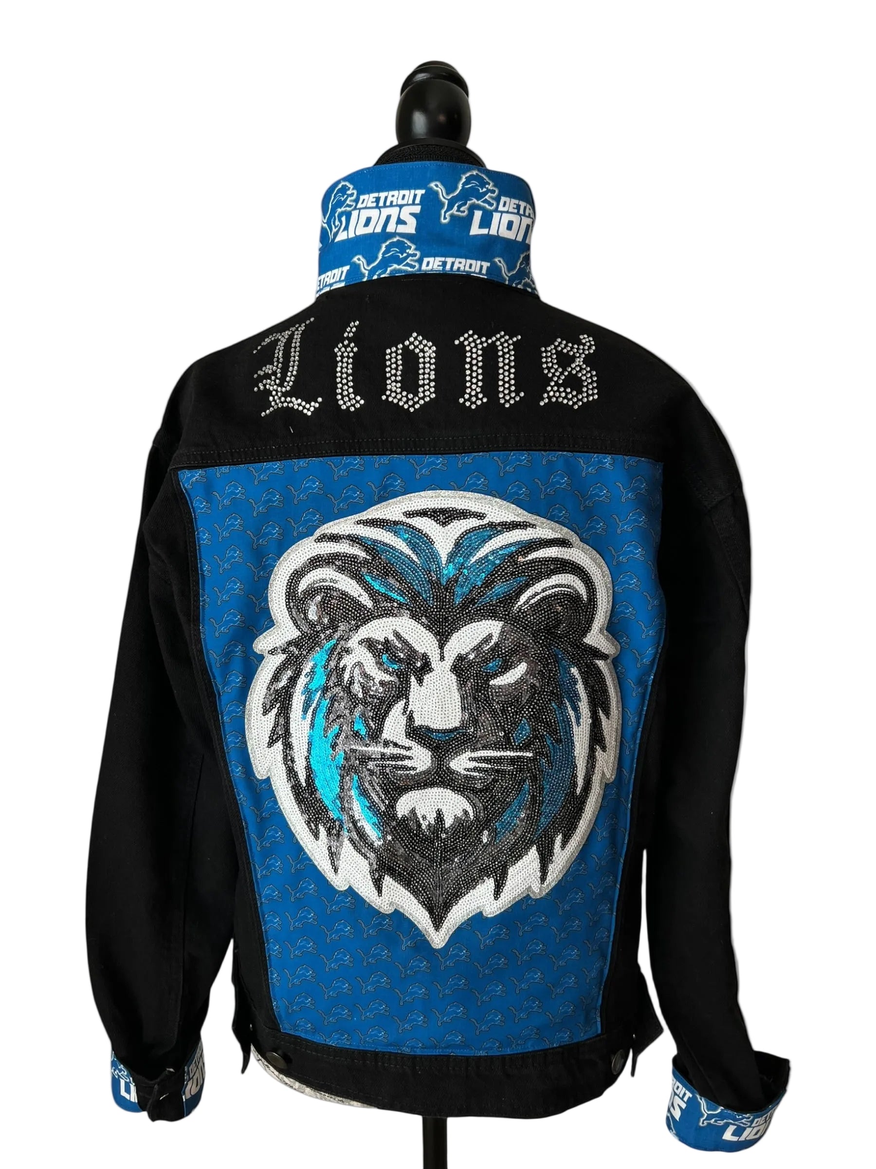 Black jacket with blue lion emblem and 'Lions' text