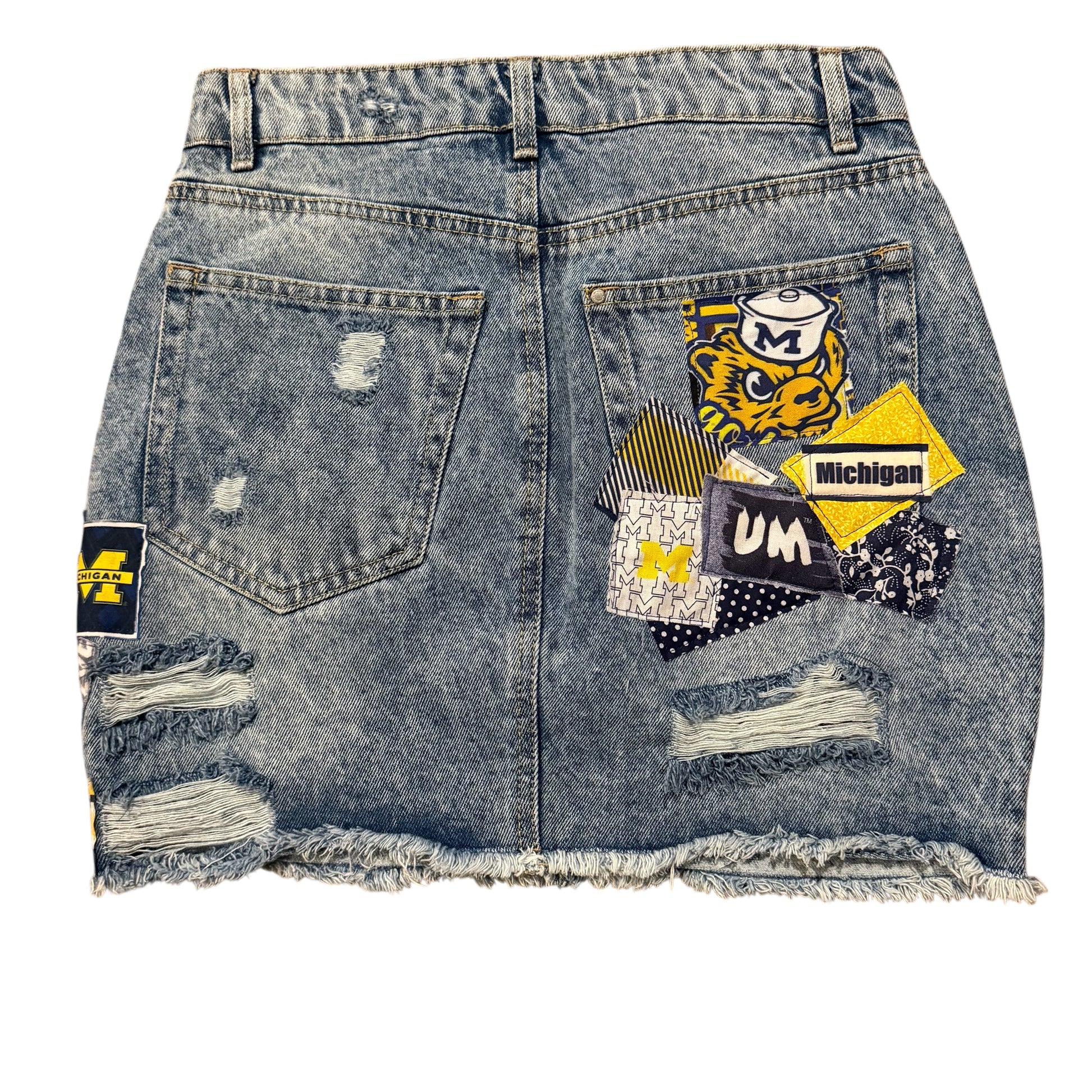 Denim skirt with patches and frayed edges 