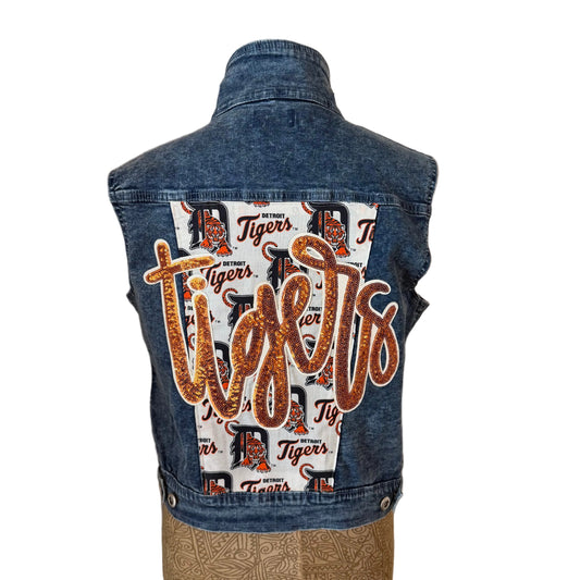 Denim vest with 'Tigers' text and logo on a beige background