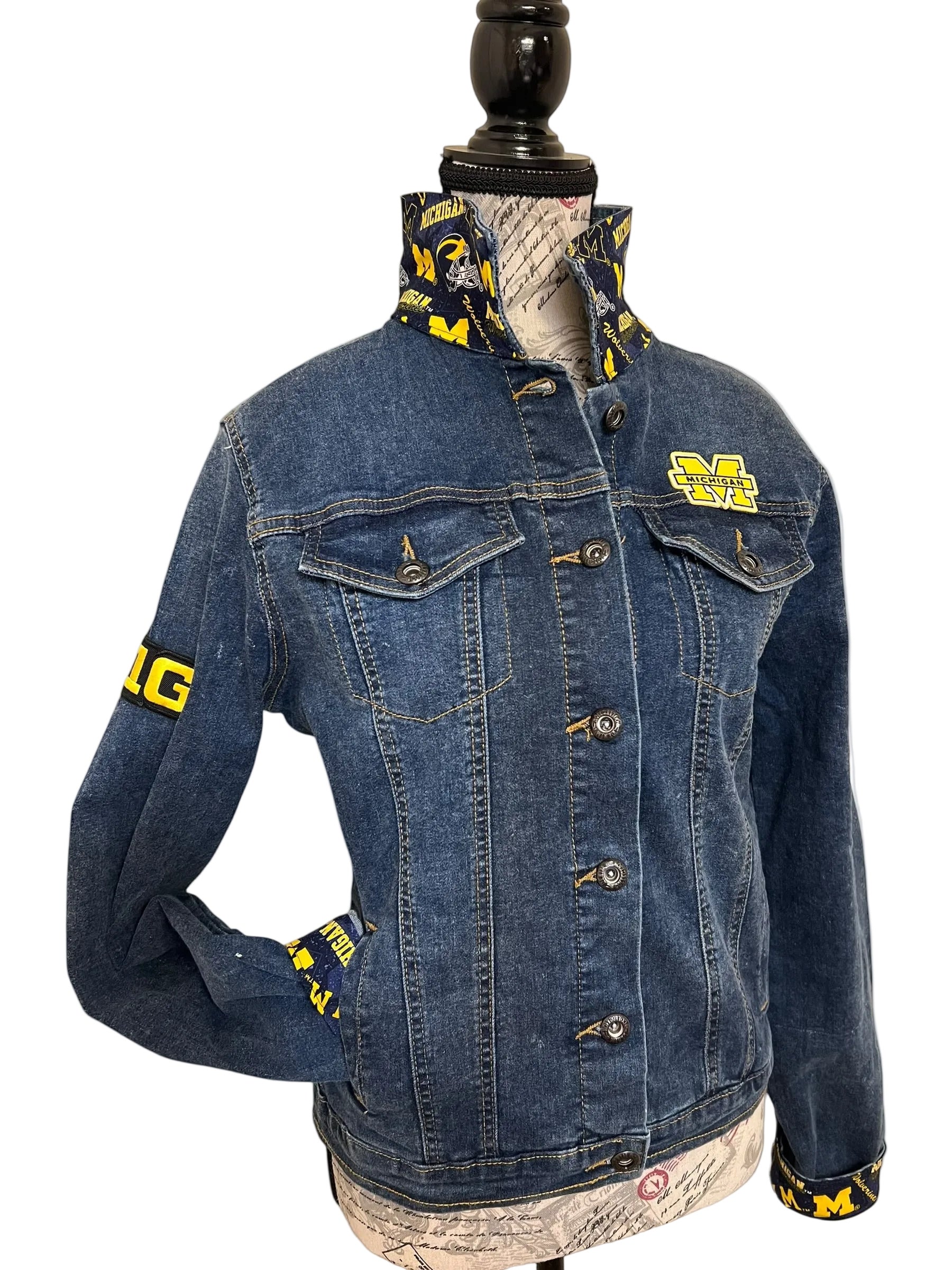 Blue denim jacket with yellow branding 
