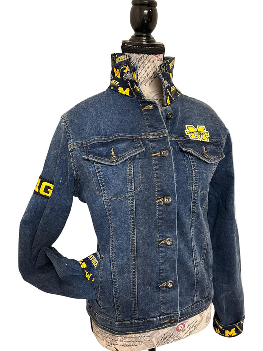 Blue denim jacket with yellow branding 